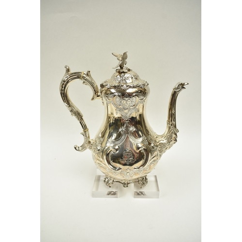 8009 - A Martin, Hall & Co. Victorian silver four piece tea set of highly ornate form.  Both pots lids are ... 