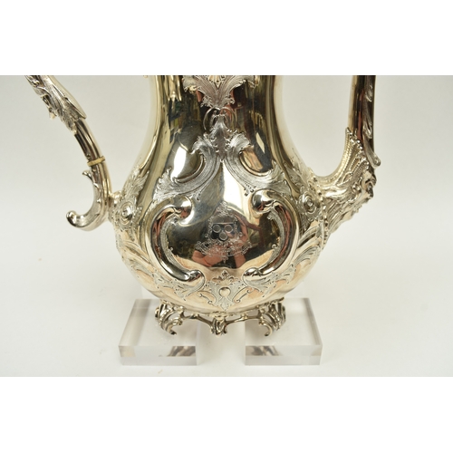 8009 - A Martin, Hall & Co. Victorian silver four piece tea set of highly ornate form.  Both pots lids are ... 