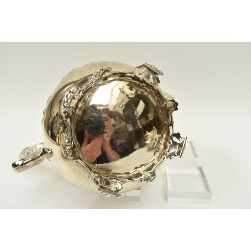 8009 - A Martin, Hall & Co. Victorian silver four piece tea set of highly ornate form.  Both pots lids are ... 