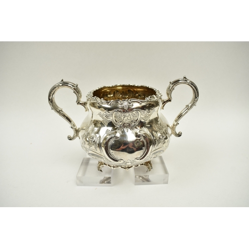 8009 - A Martin, Hall & Co. Victorian silver four piece tea set of highly ornate form.  Both pots lids are ... 