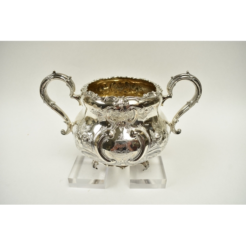 8009 - A Martin, Hall & Co. Victorian silver four piece tea set of highly ornate form.  Both pots lids are ... 
