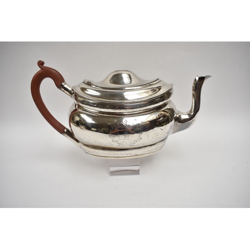 8027 - A Richard Sawyer, Dublin, silver oval teapot with monogrammed and crested cartouches, 1804, together... 