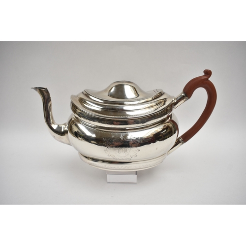 8027 - A Richard Sawyer, Dublin, silver oval teapot with monogrammed and crested cartouches, 1804, together... 