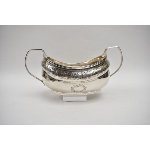 8027 - A Richard Sawyer, Dublin, silver oval teapot with monogrammed and crested cartouches, 1804, together... 