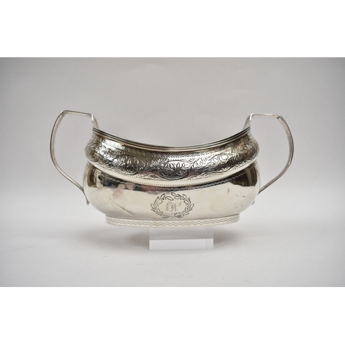 8027 - A Richard Sawyer, Dublin, silver oval teapot with monogrammed and crested cartouches, 1804, together... 