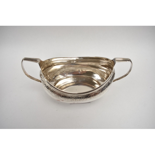 8027 - A Richard Sawyer, Dublin, silver oval teapot with monogrammed and crested cartouches, 1804, together... 