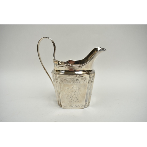 8027 - A Richard Sawyer, Dublin, silver oval teapot with monogrammed and crested cartouches, 1804, together... 