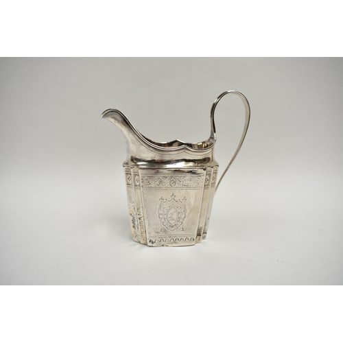 8027 - A Richard Sawyer, Dublin, silver oval teapot with monogrammed and crested cartouches, 1804, together... 