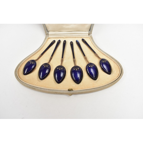 8041 - Henry James Hulbert cased set of six silver gilt and guilloche teaspoons one with damage to end of h... 