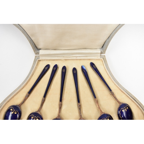 8041 - Henry James Hulbert cased set of six silver gilt and guilloche teaspoons one with damage to end of h... 