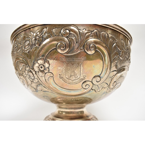 8019 - A London silver presentation bowl with embossed floral detail.  One cartouche is engraved with the H... 