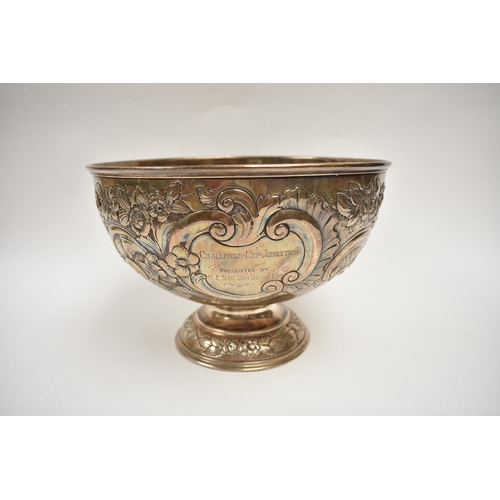 8019 - A London silver presentation bowl with embossed floral detail.  One cartouche is engraved with the H... 