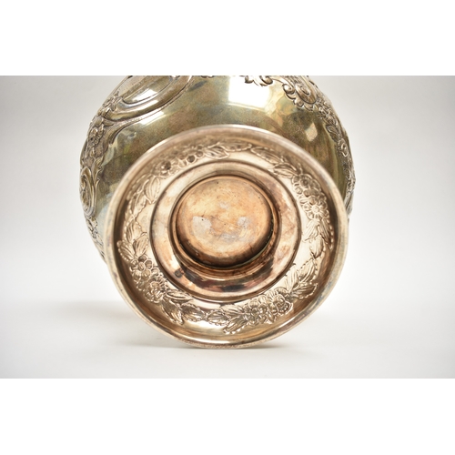 8019 - A London silver presentation bowl with embossed floral detail.  One cartouche is engraved with the H... 