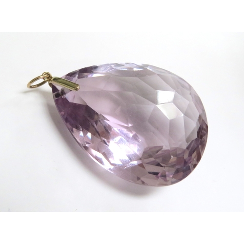 6046 - A large tear drop shaped facet cut amethyst pendant, 5cm x 4cm, 9ct gold pendant mount