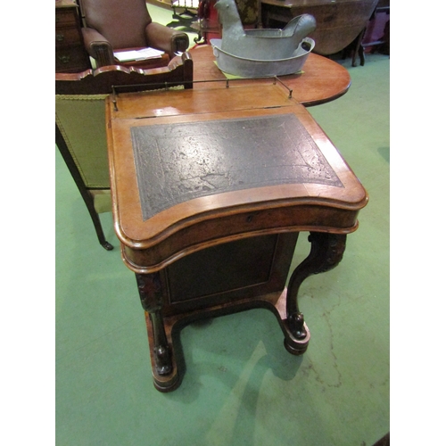 4064 - Circa 1850, a burr walnut Davenport the brass gallery over a fitted maple interior over four drawers... 