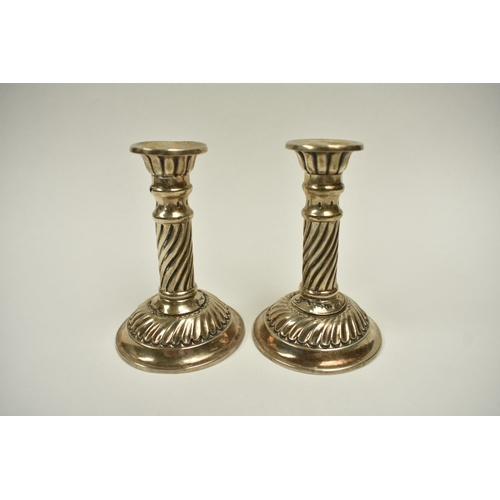8018 - A pair of Victorian Walker & Hall silver taper candlesticks, wrythen detail, weighted bases, damage ... 