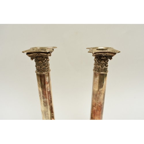 8012 - A pair of late Victorian Reid & Sons silver tall facet Corinthian column candlesticks on cushioned b... 