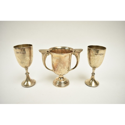 8025 - Three silver trophy cups presented to Rosalie Clark at High March School all with engraved details, ... 