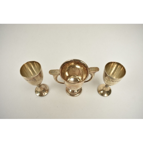 8025 - Three silver trophy cups presented to Rosalie Clark at High March School all with engraved details, ... 