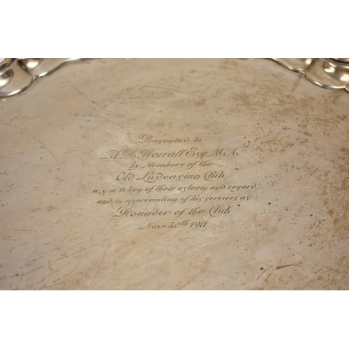 8032 - A Thomas Bradbury & Sons Ltd silver salver of piecrust edge form raised on three scroll feet with ce... 