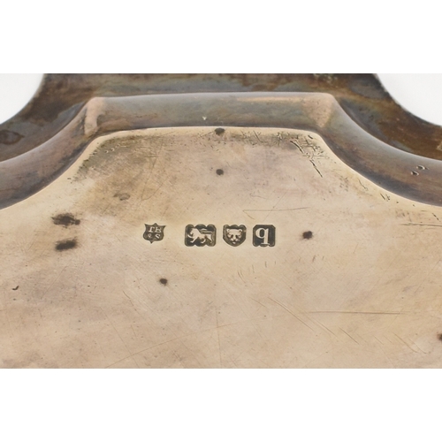 8032 - A Thomas Bradbury & Sons Ltd silver salver of piecrust edge form raised on three scroll feet with ce... 