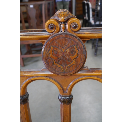 2001 - A pair of Victorian walnut Aesthetic movement chairs with inlaid butterflies, seats for recovering
