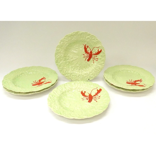 8061 - A set of six Carlton Ware Lobster plates with relief moulded designs. 23cm diameter