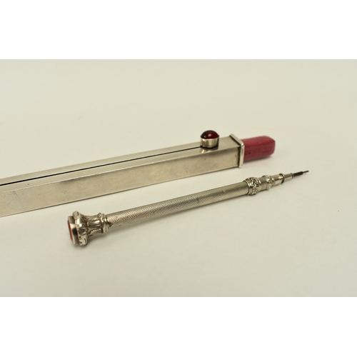 8043 - A silver 7 inch ruler with integral propelling wax and pencil set with unengraved seal top, extendin... 