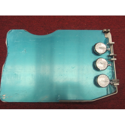 7064 - An aluminium racing clip board with three Precista stop watches. This item was acquired by the vendo... 