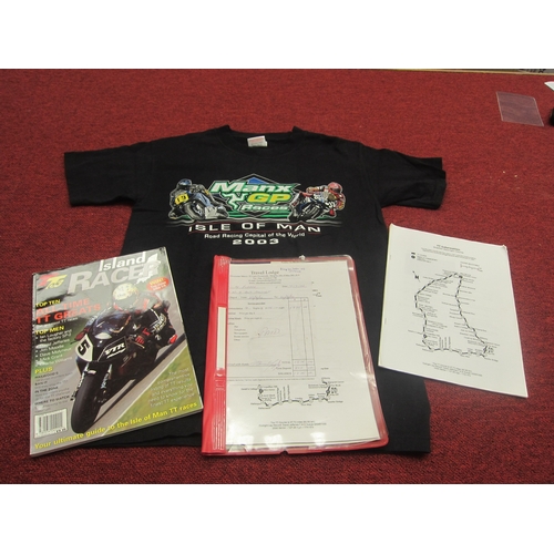 7068 - A 2003 Manx GP races Isle of Man T Shirt size S, a folder containing TT ephemera and a copy of Islan... 