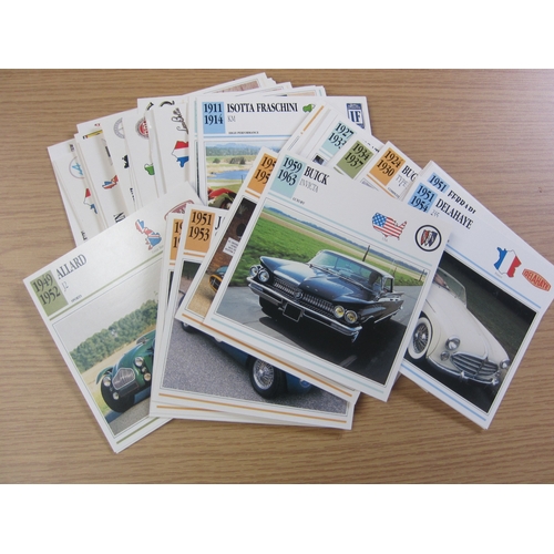 7067 - A quantity of information cards covering various Marques, a tax disc holder, a Ford Ghia badge and a... 