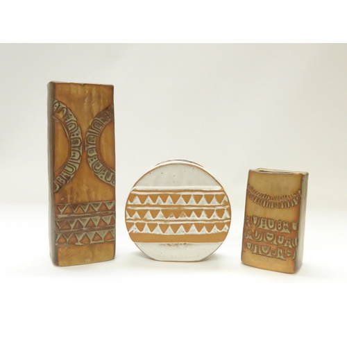 8035 - Louis Hudson Pottery - A white glazed wheel vase with relief moulded geometric detail, plus two Huds... 
