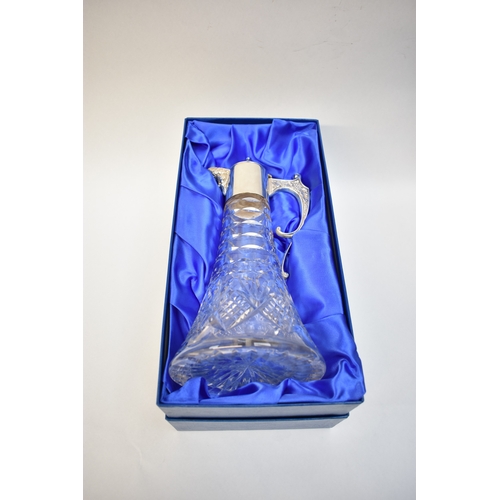 8007 - A Camelot Silver ltd silver necked claret  jug, Sheffield 2000, with crystal glass body retailed by ... 