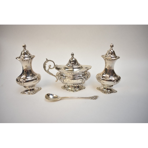 8005 - A cased Barker Brothers cruet set comprising two pepperettes & a mustard, Chester 1911, hole & dent ... 