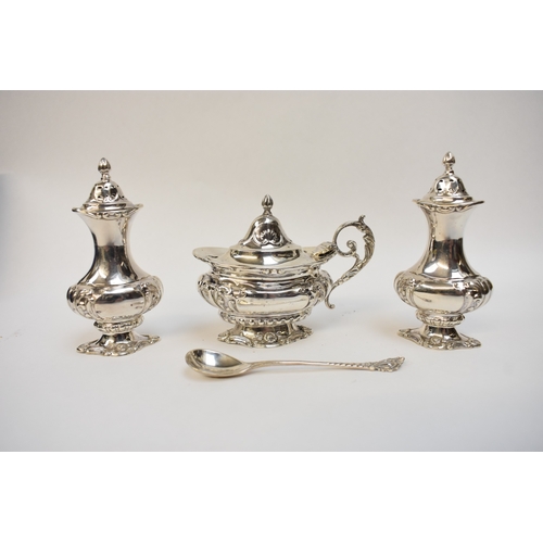 8005 - A cased Barker Brothers cruet set comprising two pepperettes & a mustard, Chester 1911, hole & dent ... 