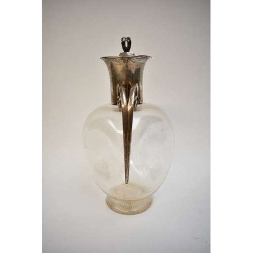 8001 - A John Grinsell & Sons silver claret jug, globular form with scrolled handle, London 1899, 22cm tall... 