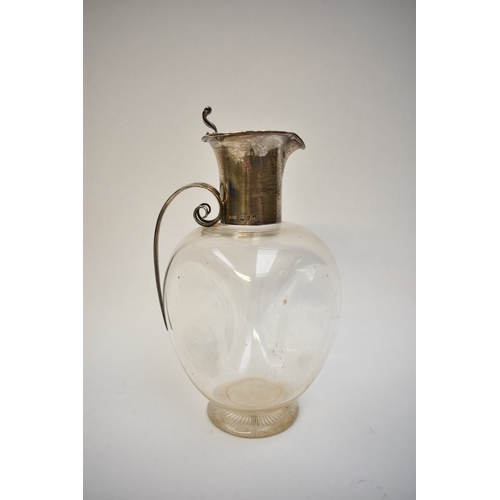 8001 - A John Grinsell & Sons silver claret jug, globular form with scrolled handle, London 1899, 22cm tall... 