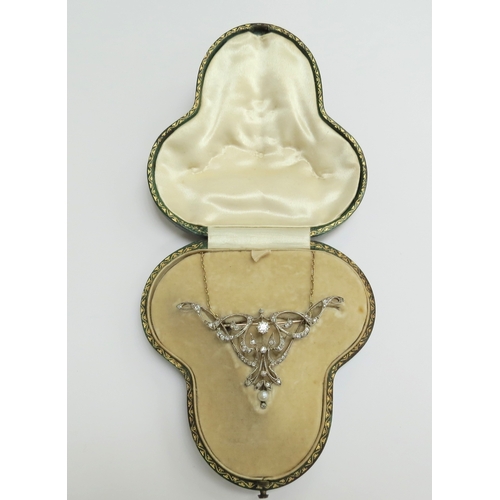 7034 - A diamond encrusted brooch/pendant in yellow and white metal with a single pearl to point, unmarked,... 