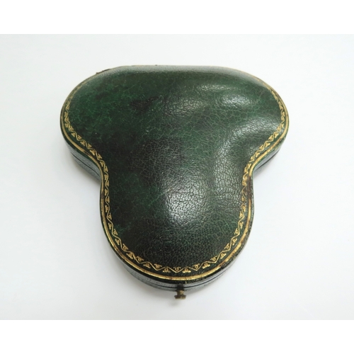 7034 - A diamond encrusted brooch/pendant in yellow and white metal with a single pearl to point, unmarked,... 