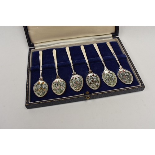 8051 - A Cohen & Charles set of six silver coffee / tea spoons, the bowls hand painted with scrolled foliag... 
