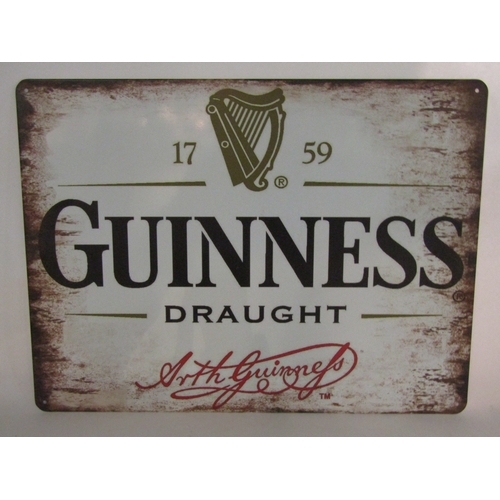 4260 - A Guinness Draught tin plate advertising sign, 30cm x 40cm