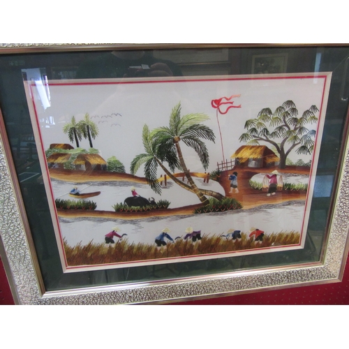4064 - Two Oriental embroidered pictures, gent with baskets on bicycle and farm workers together another Or... 