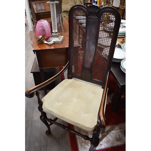 4205 - A Charles II revival walnut open armchair, the carved double dome top back rest with carved detail o... 