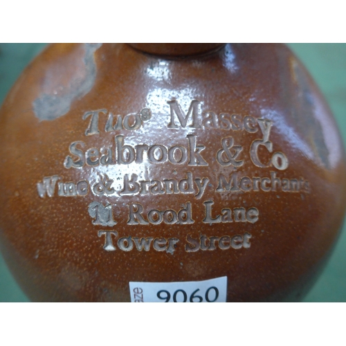 9060 - A glazed flagon Thos. Massey Seabrook & Co, Tower Street, 37cm tall