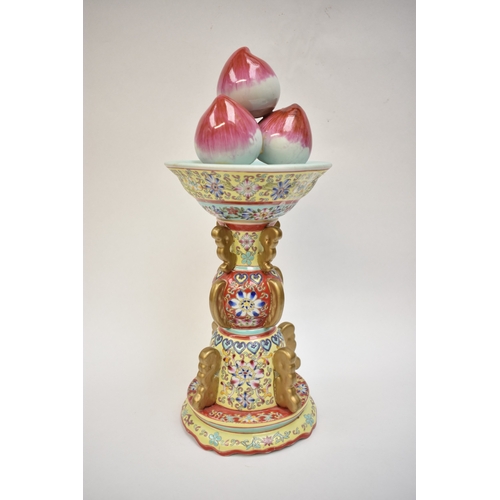 1001 - A Peoples Republic of China, table centrepiece, fruit held aloft, floral decorated column, blue Qian... 