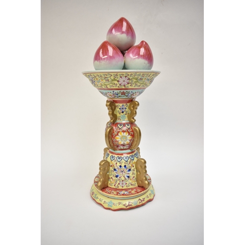 1001 - A Peoples Republic of China, table centrepiece, fruit held aloft, floral decorated column, blue Qian... 