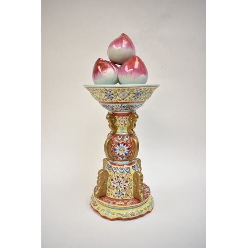 1001 - A Peoples Republic of China, table centrepiece, fruit held aloft, floral decorated column, blue Qian... 