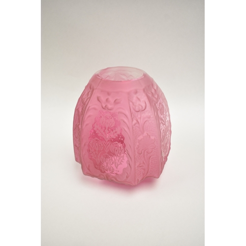 1011 - A late 19th Century French cranberry glass oil lamp with Art Nouveau moulded shade, above cranberry ... 