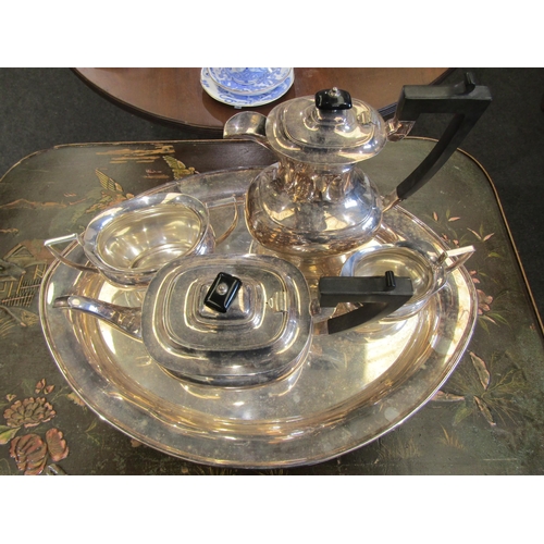 1019 - An Edwardian silver plated four piece tea set and tray