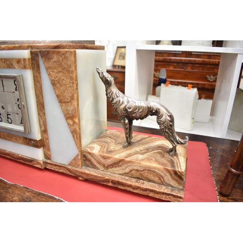 1031 - An Art Deco mantel clock bearing signatures to hounds FH DANVIN, movement by Samuel Martin visible c... 